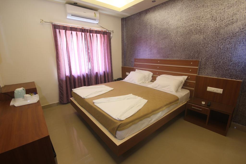 Urmee Hotel Bhubaneswar Værelse billede