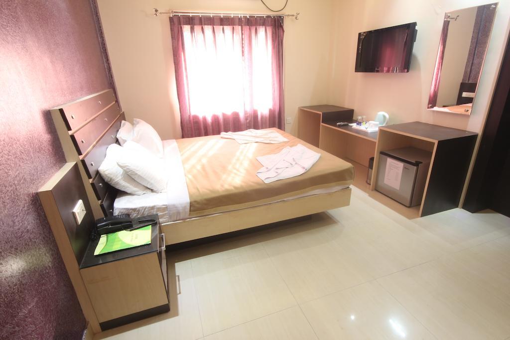 Urmee Hotel Bhubaneswar Værelse billede